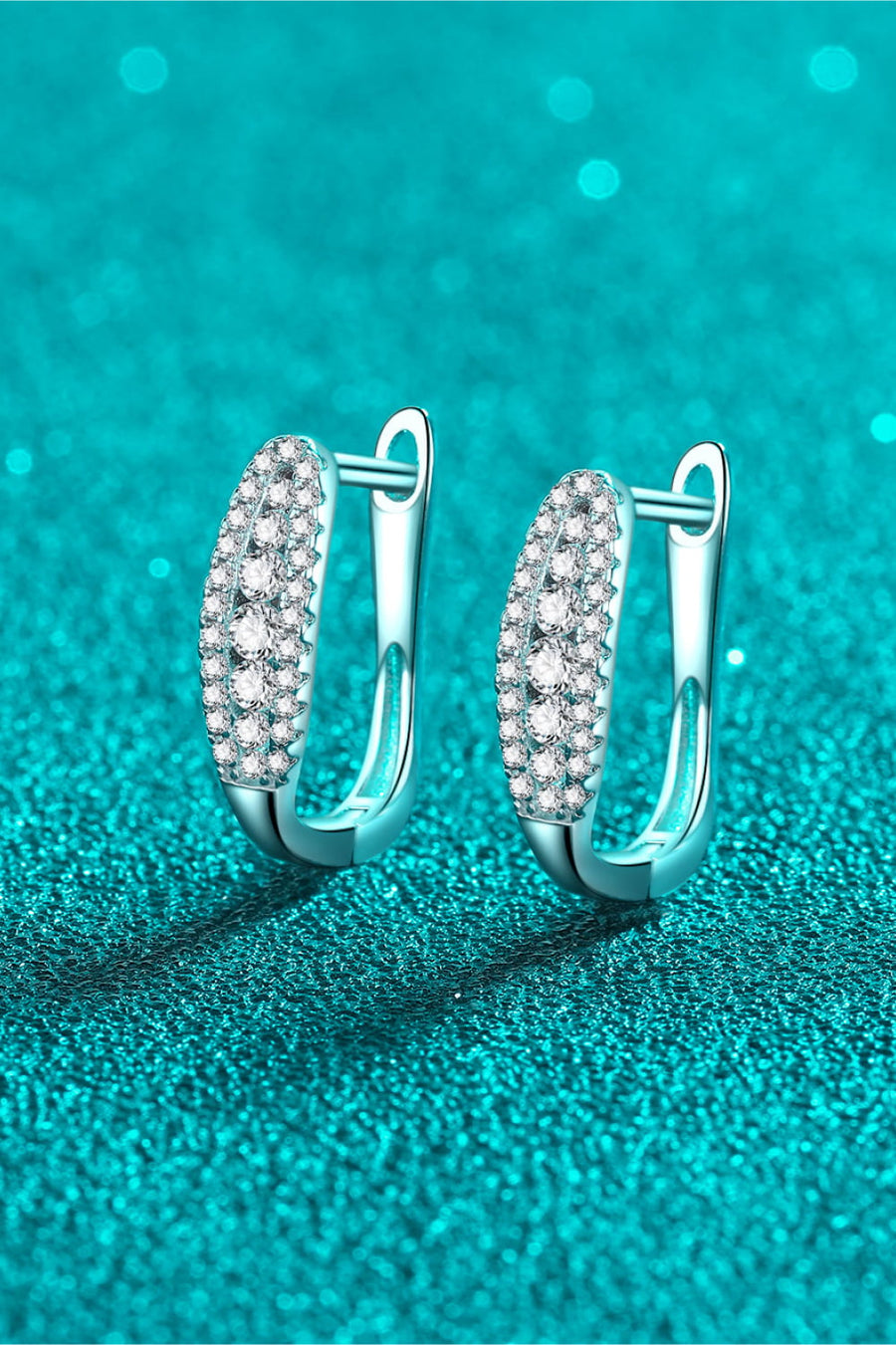 Silver pavé hoop earrings with clear stones, modern essential style.