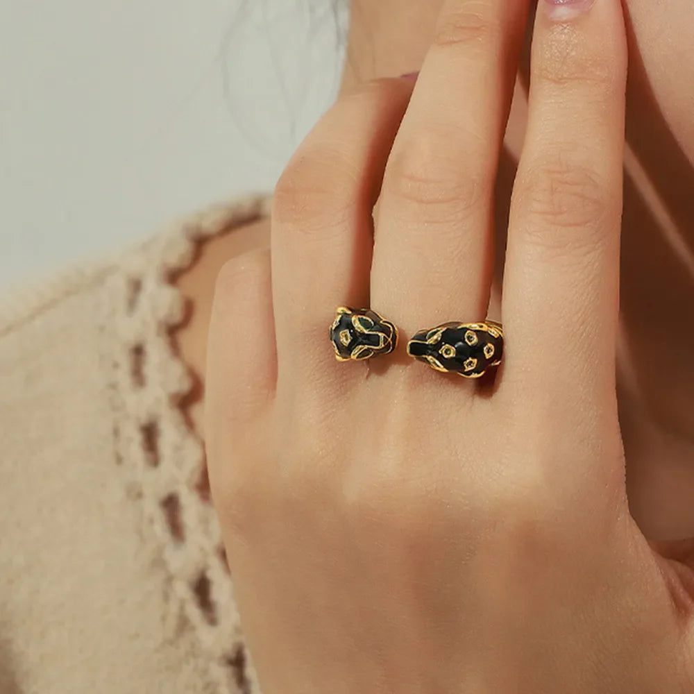 Gold panther head open ring with black enamel detail
