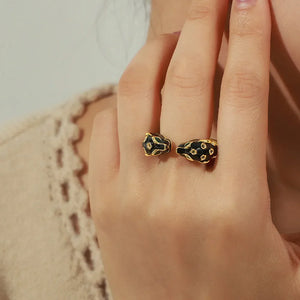 Gold panther head open ring with black enamel detail