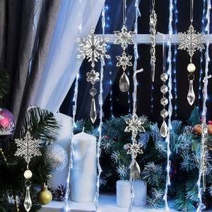 Transparent acrylic snowflake and icicle Christmas ornaments hanging with crystal drops.