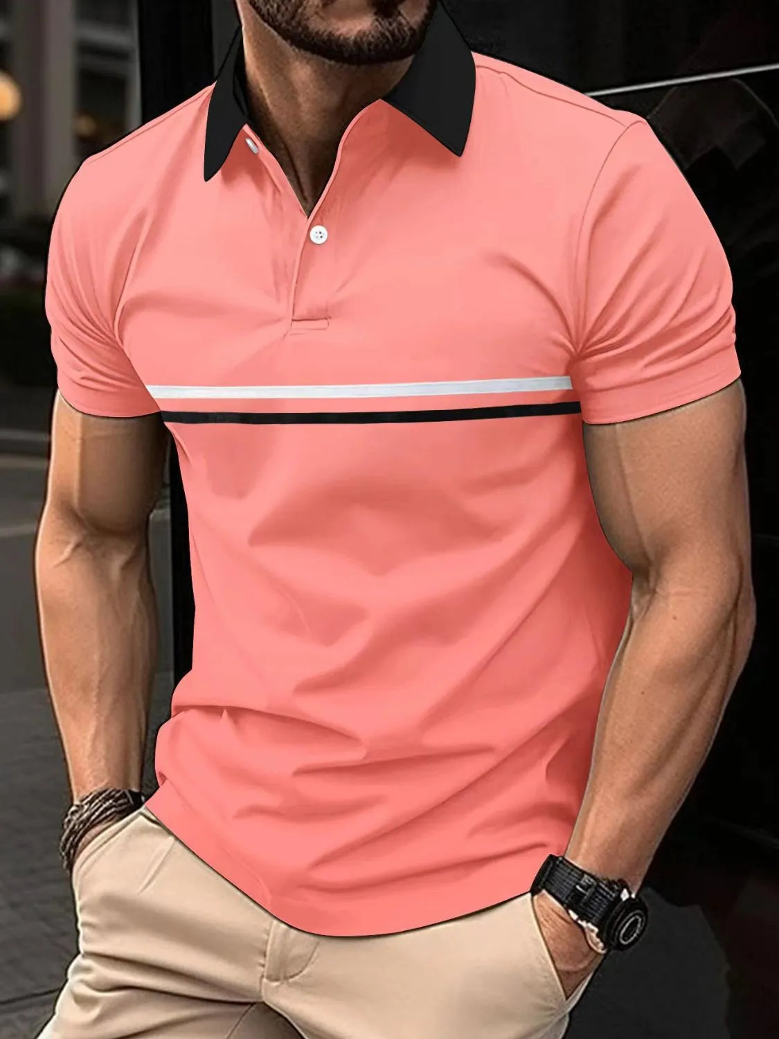 Coral polo shirt with black collar and contrast stripe detail
