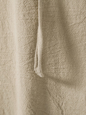Men's beige cotton lace-up hooded top detail