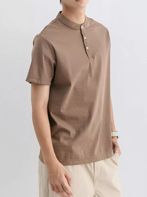 Brown cotton t-shirt with mandarin collar and button placket, short sleeves.