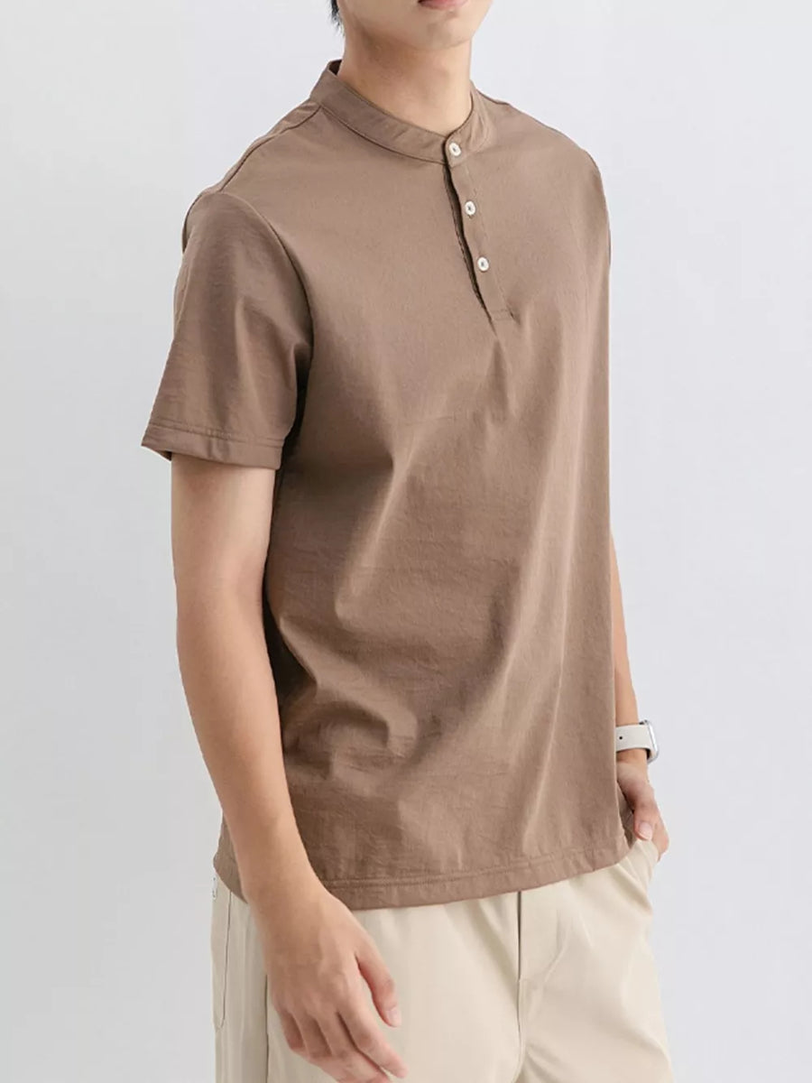 Brown cotton t-shirt with mandarin collar and button placket, short sleeves.
