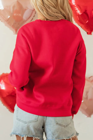 Red crewneck sweatshirt with long sleeves and a relaxed fit.