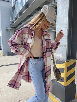 Checkered collar shirt jacket in pink plaid with a longline cut and button front.