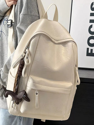 Chic pu leather medium backpack in white with a dachshund charm and front pocket.