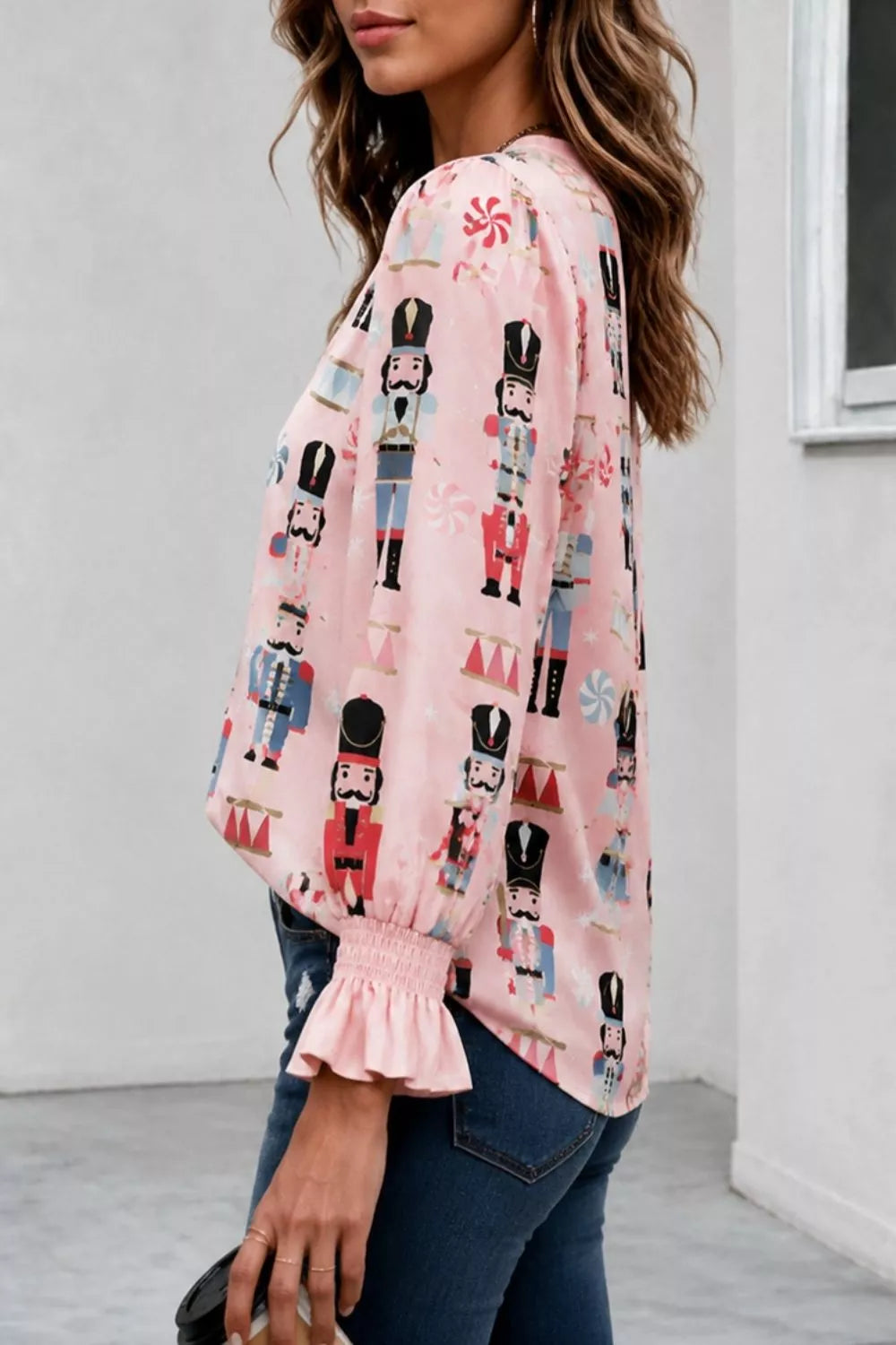 blouse in light blue with nutcracker print and ruffled