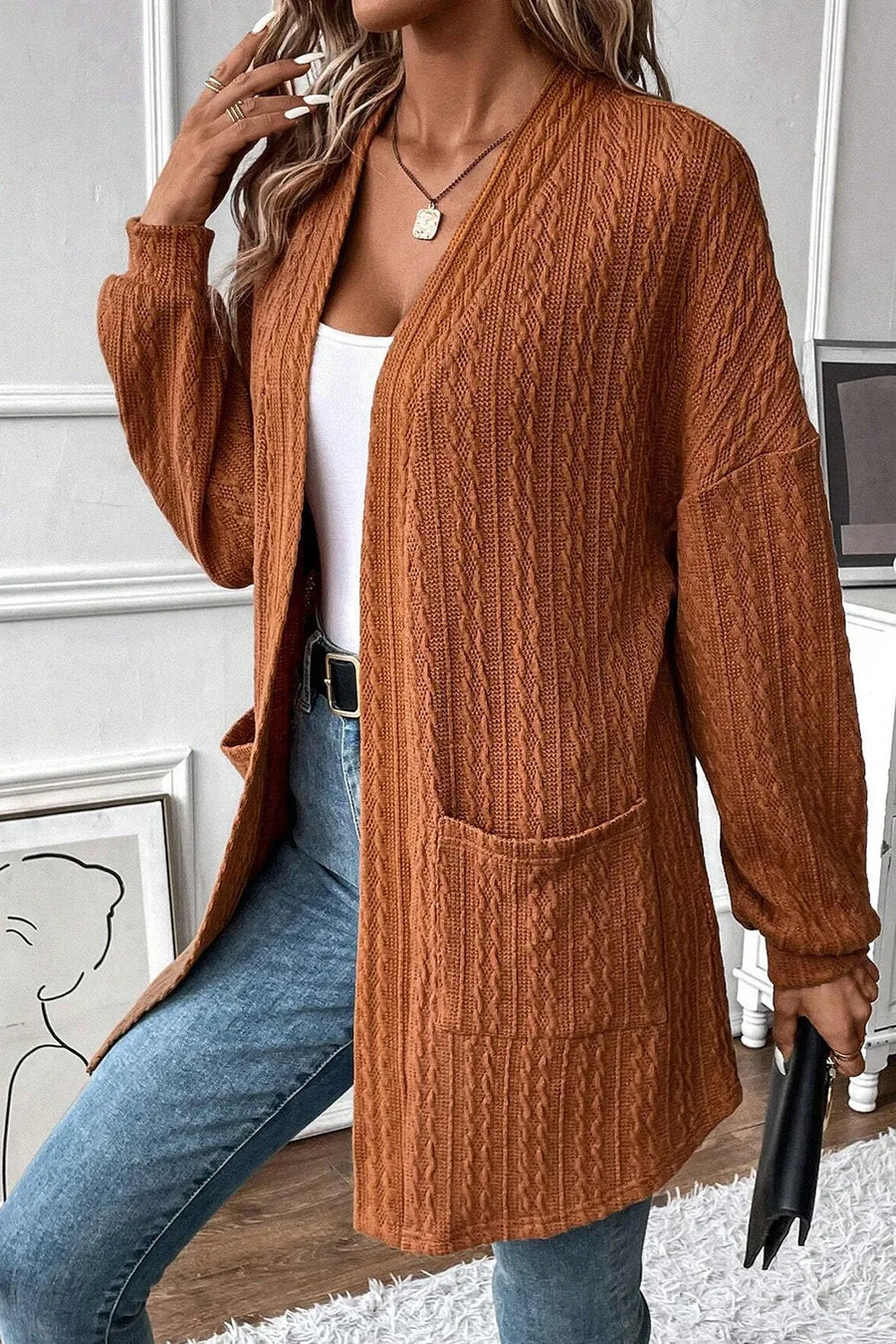 Terracotta open front cardigan with cable knit texture and pockets