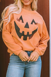 Caramel corduroy sweatshirt with jack-o'-lantern graphic and long sleeves.