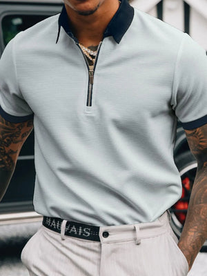 Textured zip-neck polo shirt in gray with black collar and sleeve trim.