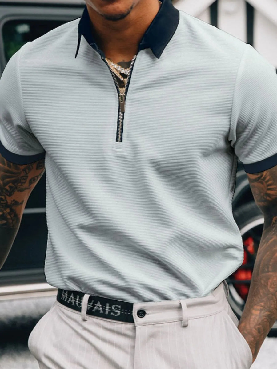 Textured zip-neck polo shirt in gray with black collar and sleeve trim.