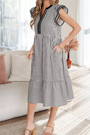 Chic black and white striped cotton midi dress with pockets and tiered skirt.