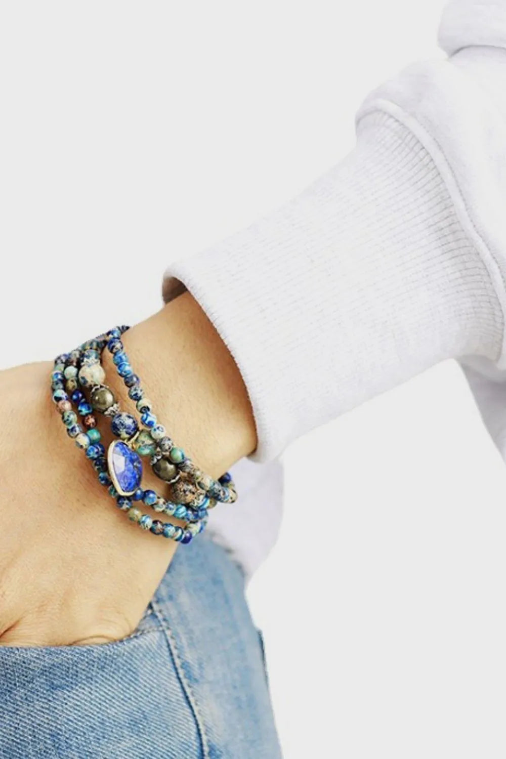 Azure Orb & Heartstone wrap bracelet in royal blue with beaded strands and a large blue stone accent.