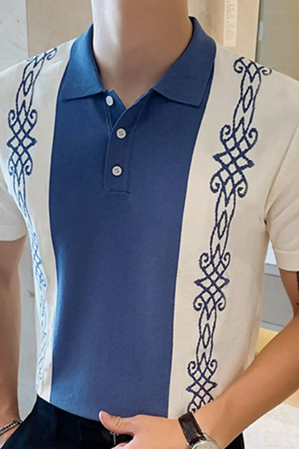 Dusty blue and white polo shirt with embroidered side panels and buttoned collar.