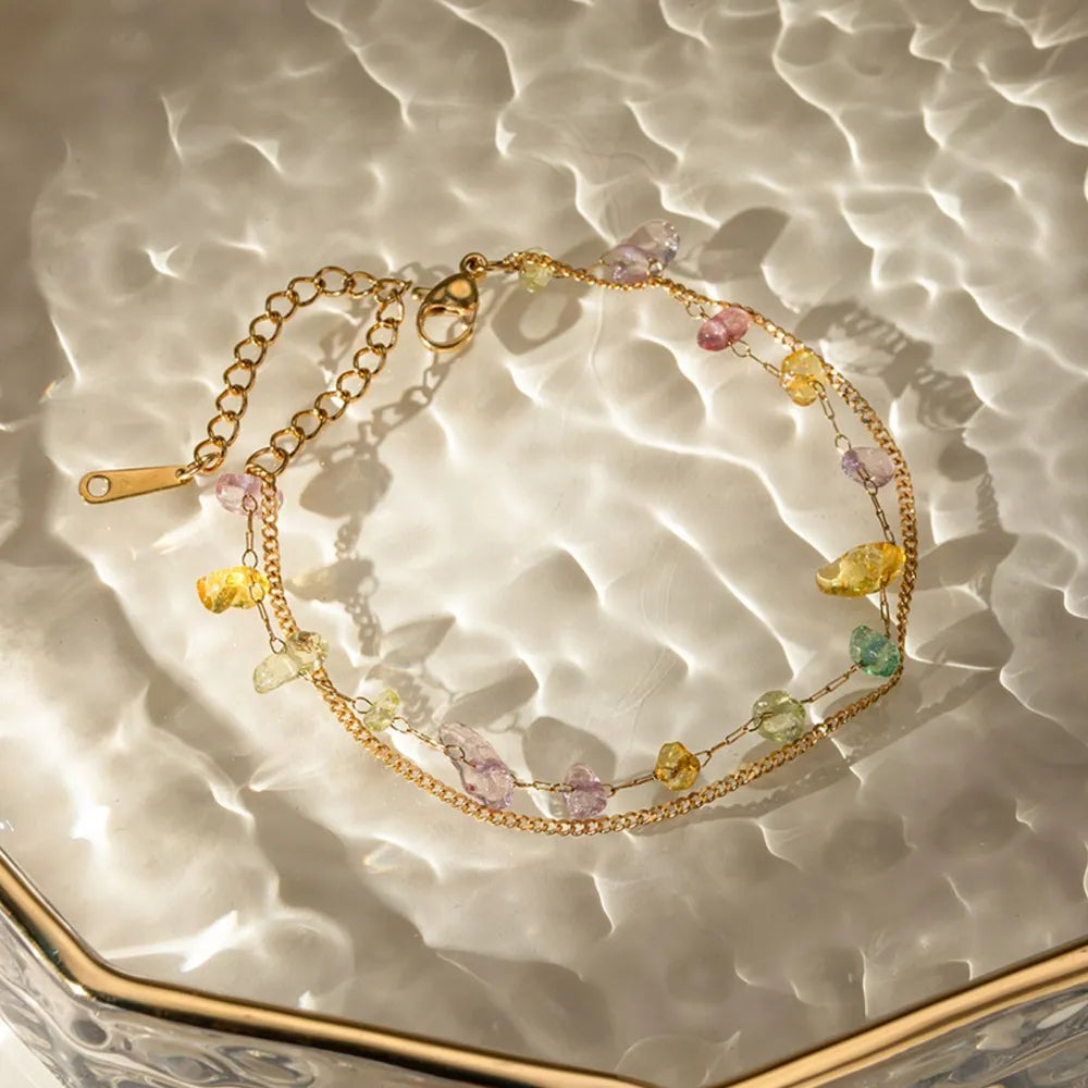 Gold double chain bracelet with colorful raw gemstones and 18K gold plating