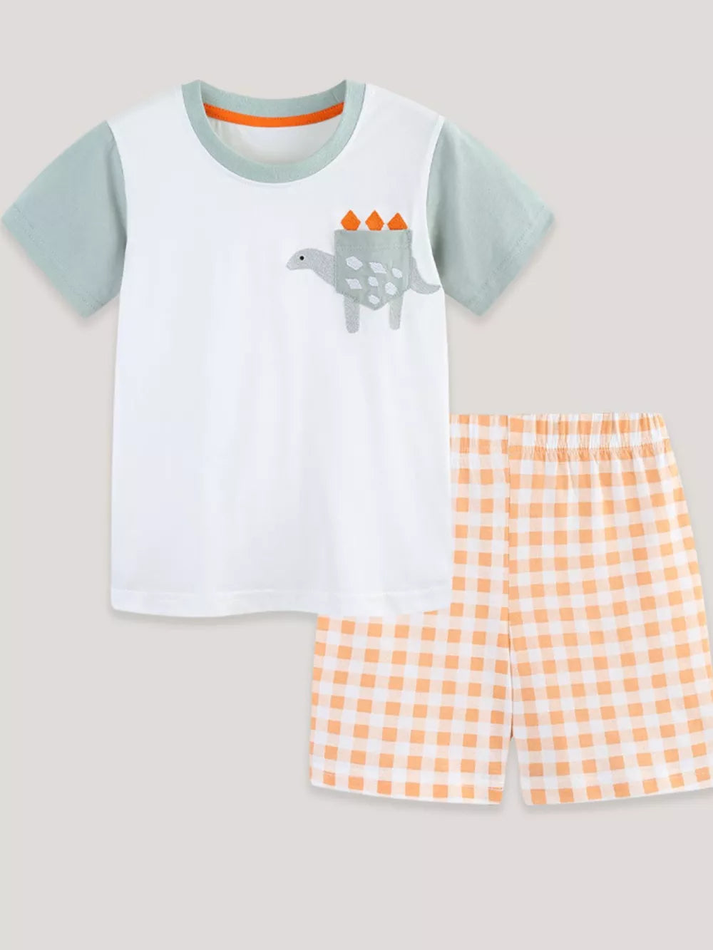 Toddler boys' cotton tee with dinosaur pocket and orange gingham shorts.