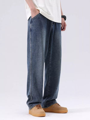 Men's blue vintage wash loose fit cotton jeans with pockets.