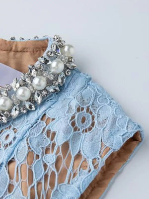 Blue lace dress with pearl and crystal embellished collar detail.