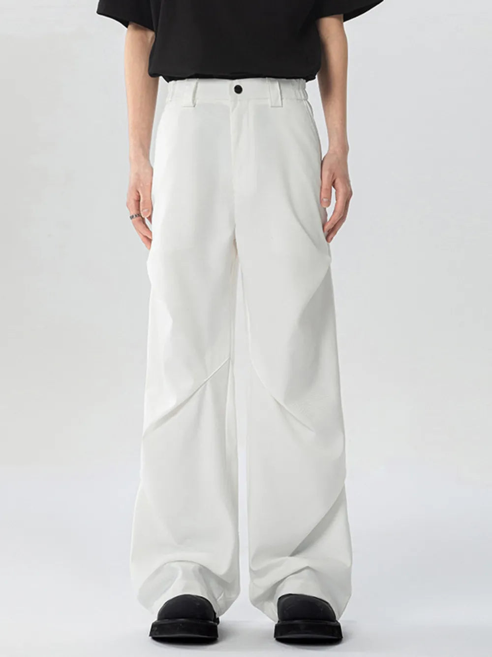 White oversized wide-leg cargo sweatpants with a relaxed fit and unique paneling.