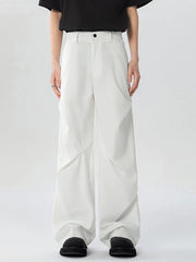White oversized wide-leg cargo sweatpants with a relaxed fit and unique paneling.