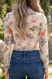 Floral sheer long sleeve maternity shirt with a high neckline.