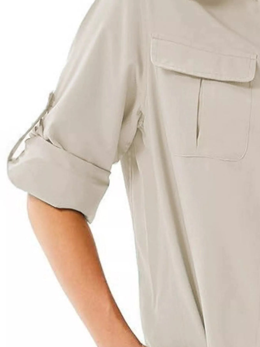 Light gray button-up shirt with roll-up sleeves and two chest pockets.