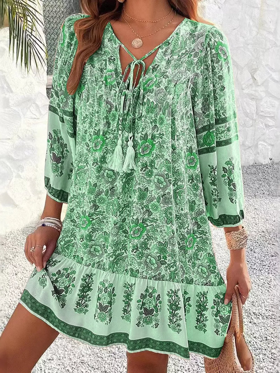 Matcha green floral print mini dress with tassel tie V-neck and tiered hem