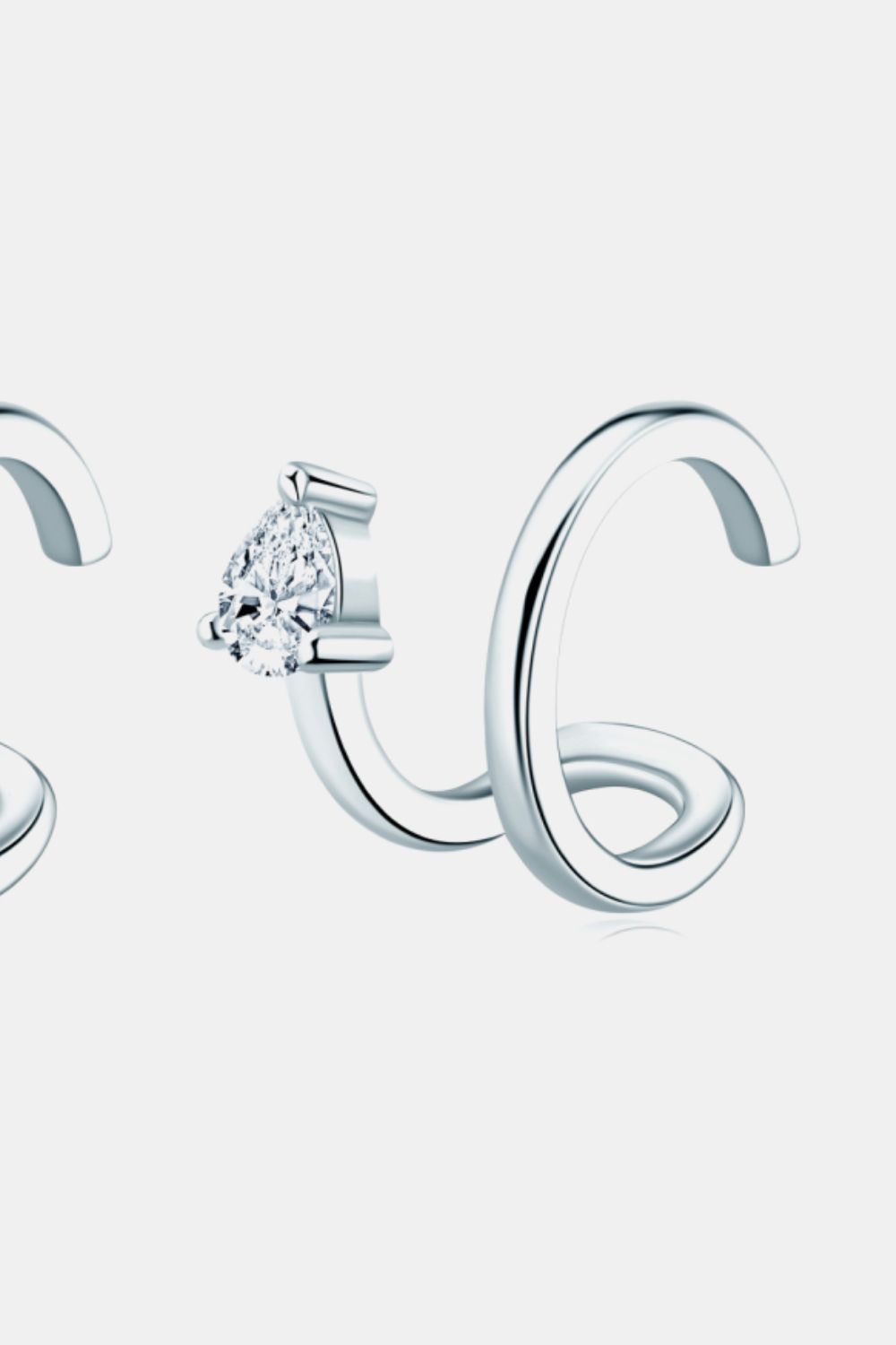 Silver spiral ear cuff with a pear-shaped diamond accent