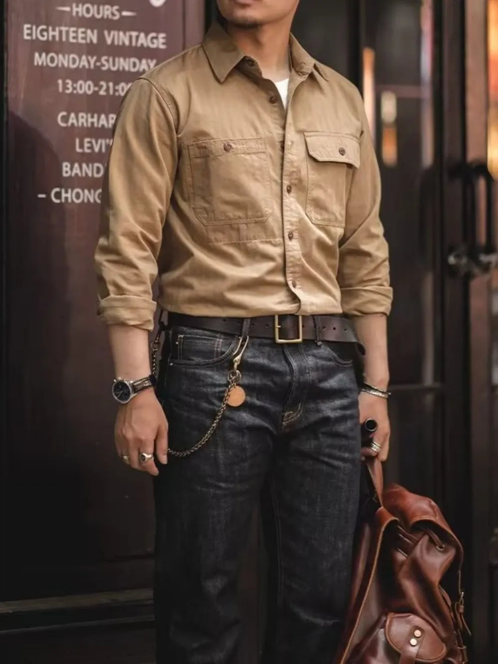 Khaki cotton twill utility shirt with two chest pockets and button front.