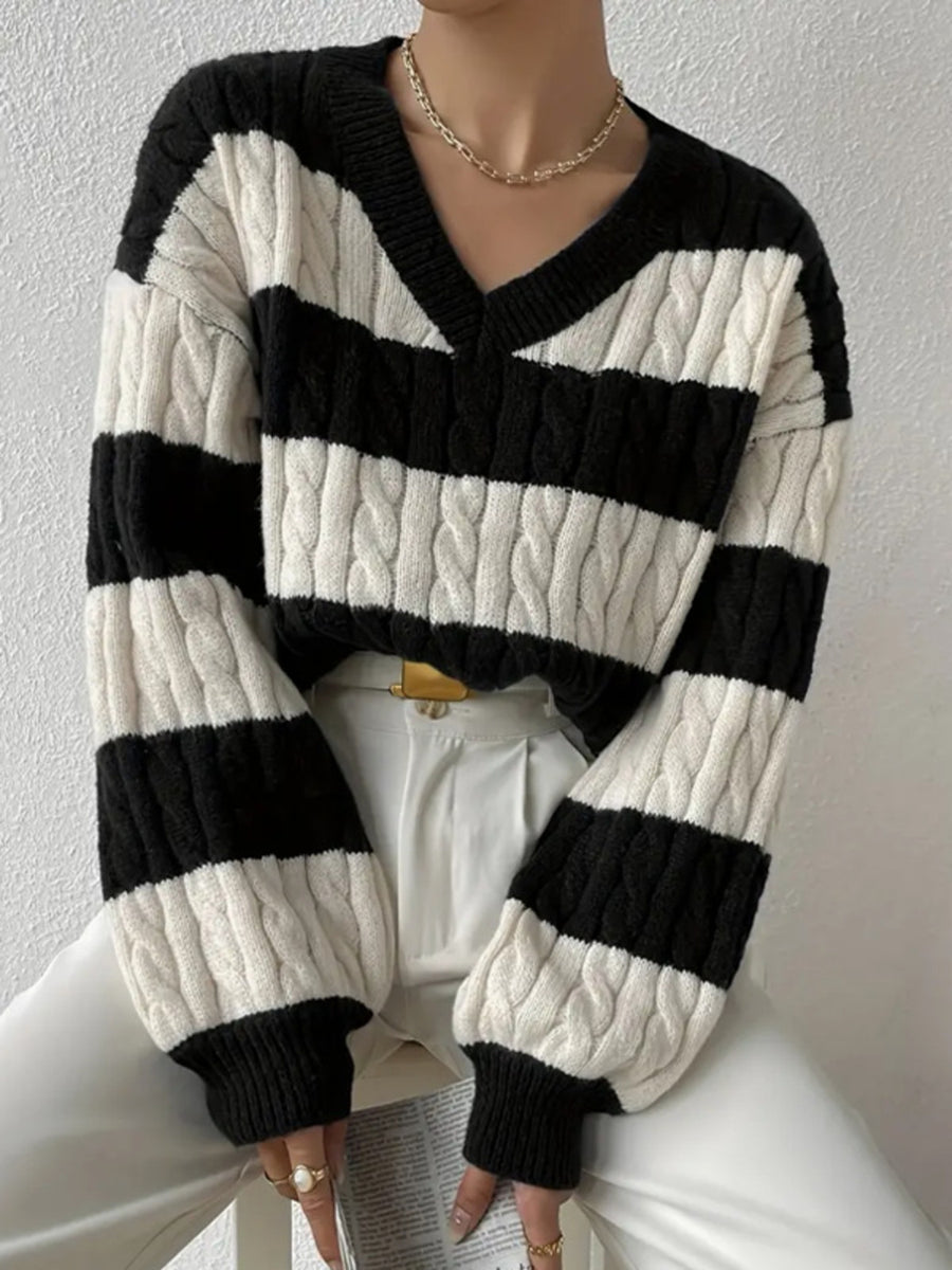 100% polyester Care instructions: Machine wash cold v-neck sweater in Purple with relaxed silhouette