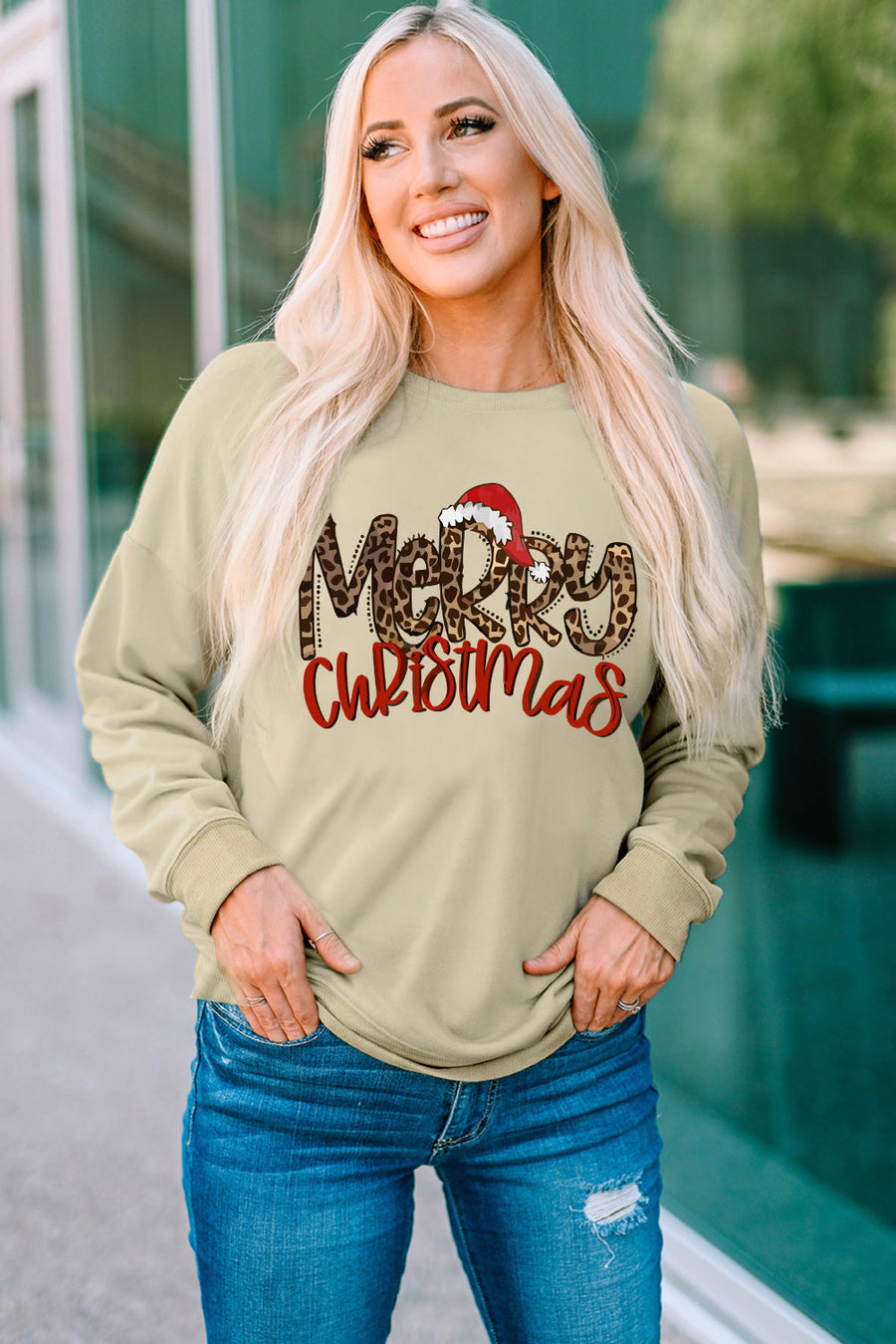 Khaki crewneck sweatshirt with leopard print Merry Christmas graphic and Santa hat detail.