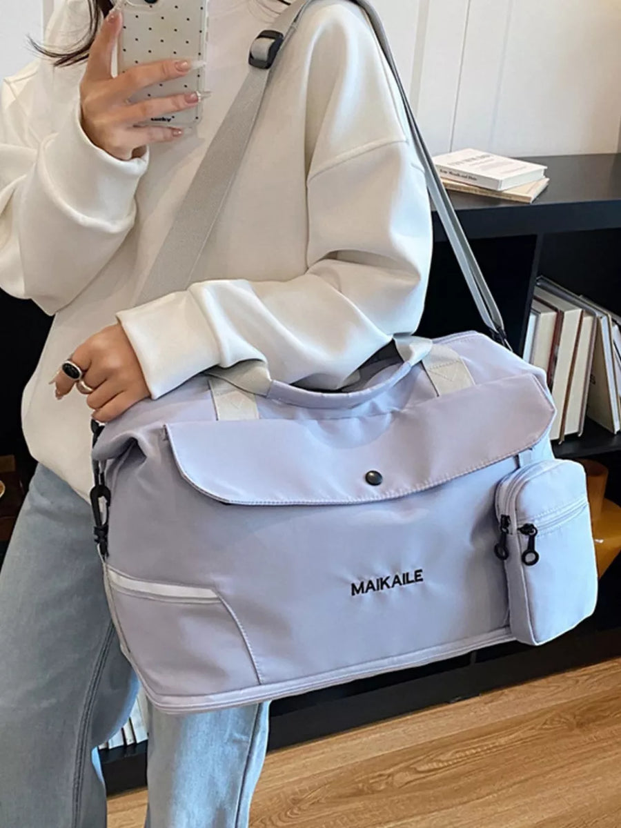 Light purple duffel bag with MAIKAILE logo and side zip pocket