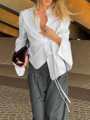 100% cotton Care instructions: Machine wash cold wrap top in White with relaxed silhouette