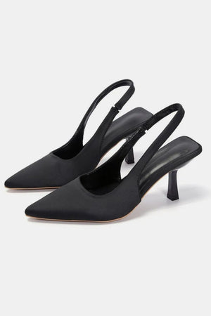 Black satin slingback pumps with sculpted heel and pointed toe