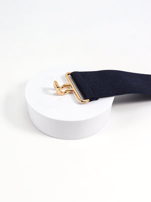 Dark blue elastic belt with a sculpted gold buckle detail