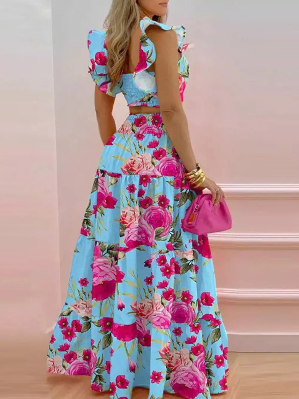 Sky blue floral ruffled crop top and tiered maxi skirt set with flutter sleeves.