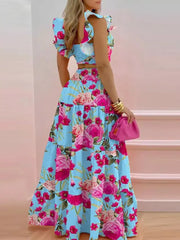 Sky blue floral ruffled crop top and tiered maxi skirt set with flutter sleeves.
