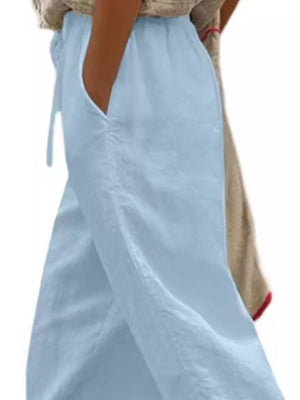 Light blue relaxed fit cropped maternity pants with drawstring and pockets.