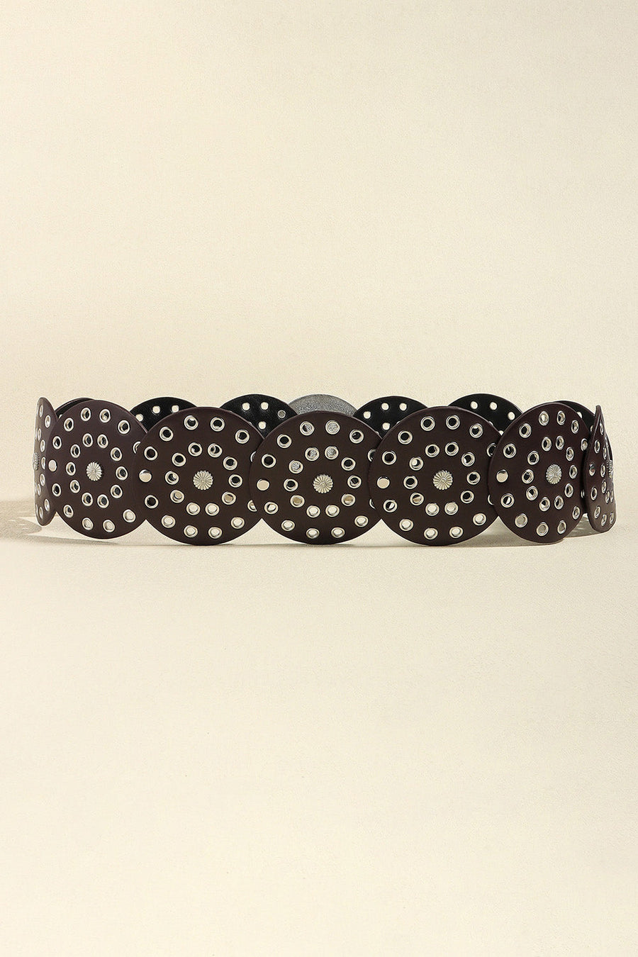 Disc-embellished belt in brown with silver eyelets and floral details.