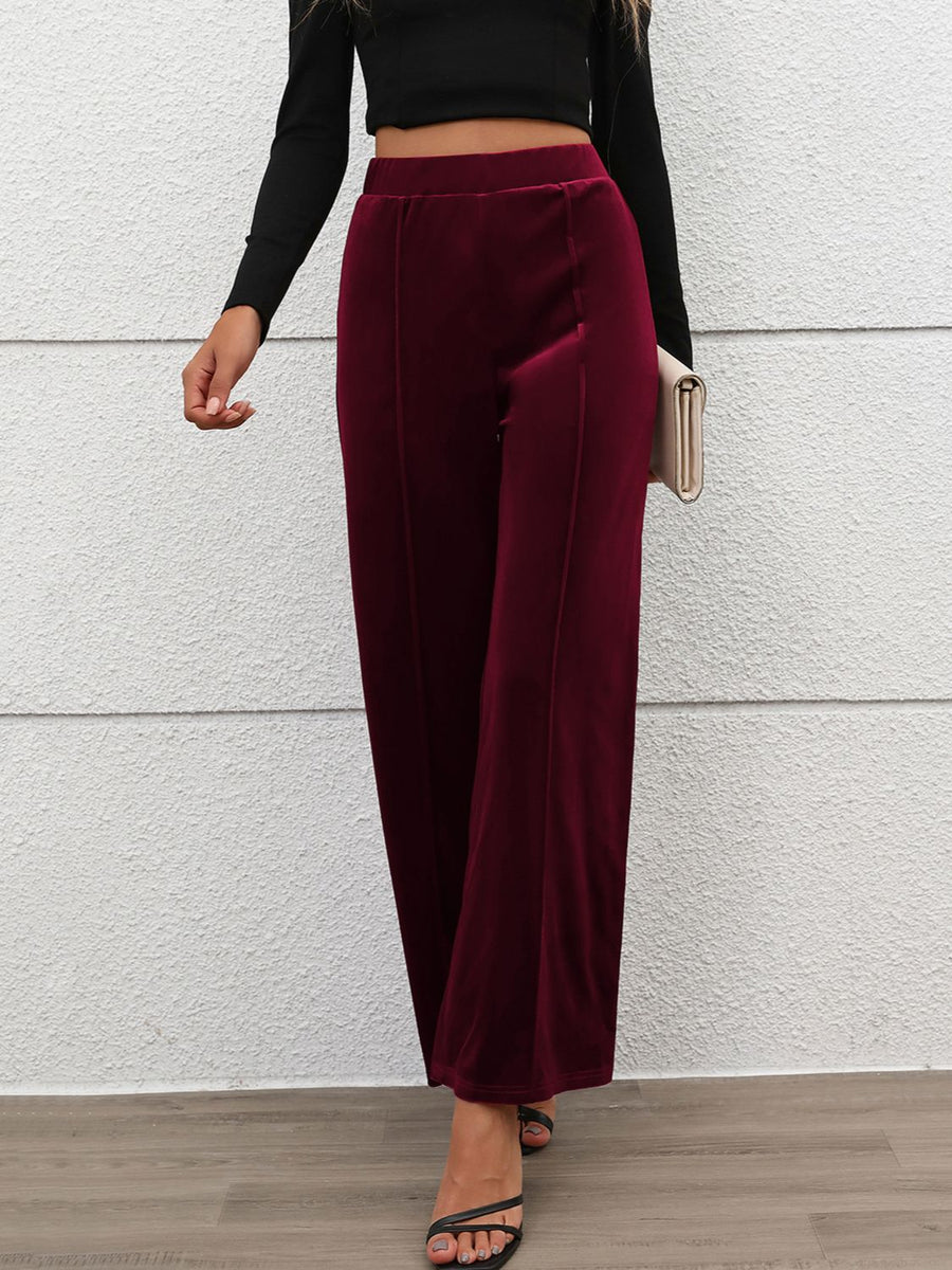 Burgundy velvet palazzo trousers with seam detail and wide leg