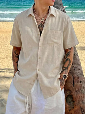 Relaxed fit beige buttoned casual shirt with short sleeves and a chest pocket.