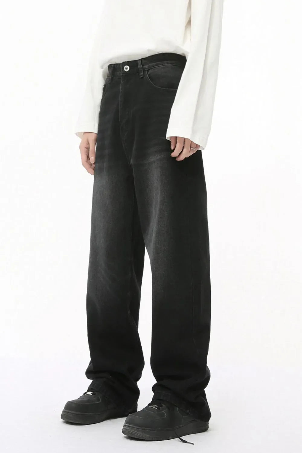 Oversized baggy wash denim trousers in dark color, relaxed fit, casual style.