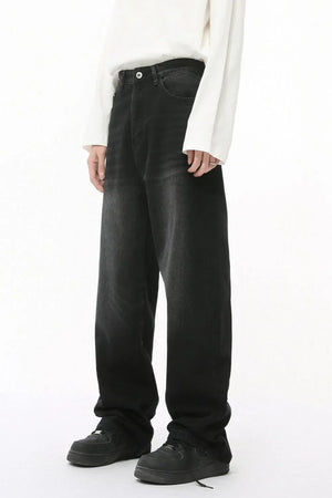 Oversized baggy wash denim trousers in dark color, relaxed fit, casual style.
