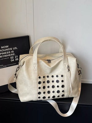 Cream travel organizer bag with eyelet detail and detachable strap