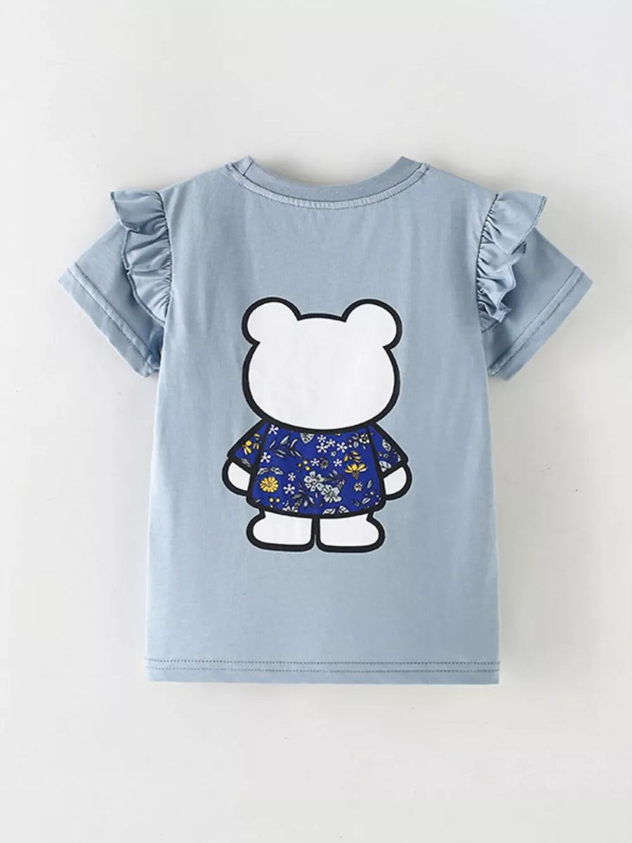 Light blue cotton t-shirt with ruffled sleeves and a playful bear graphic wearing a floral shirt.