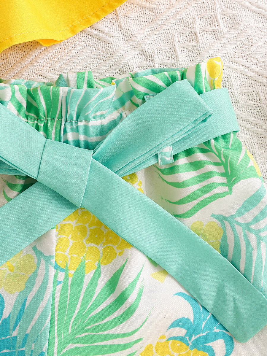 Baby shorts with pineapple and leaf print, paperbag waist, and mint green tie.
