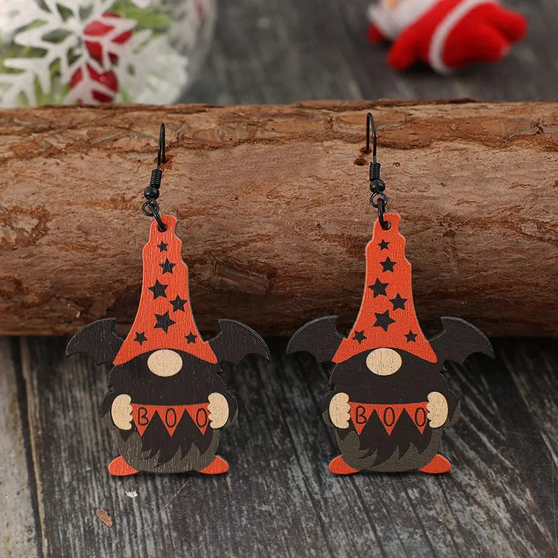 Halloween gnome wood drop earrings with bat wings and black stars on orange hats.