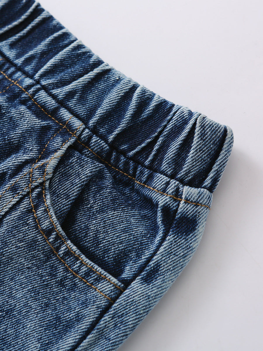 Toddler blue denim jeans with elastic waistband and pocket detail.