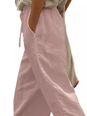 Dusty pink maternity pants with drawstring and pockets, relaxed fit cropped style.